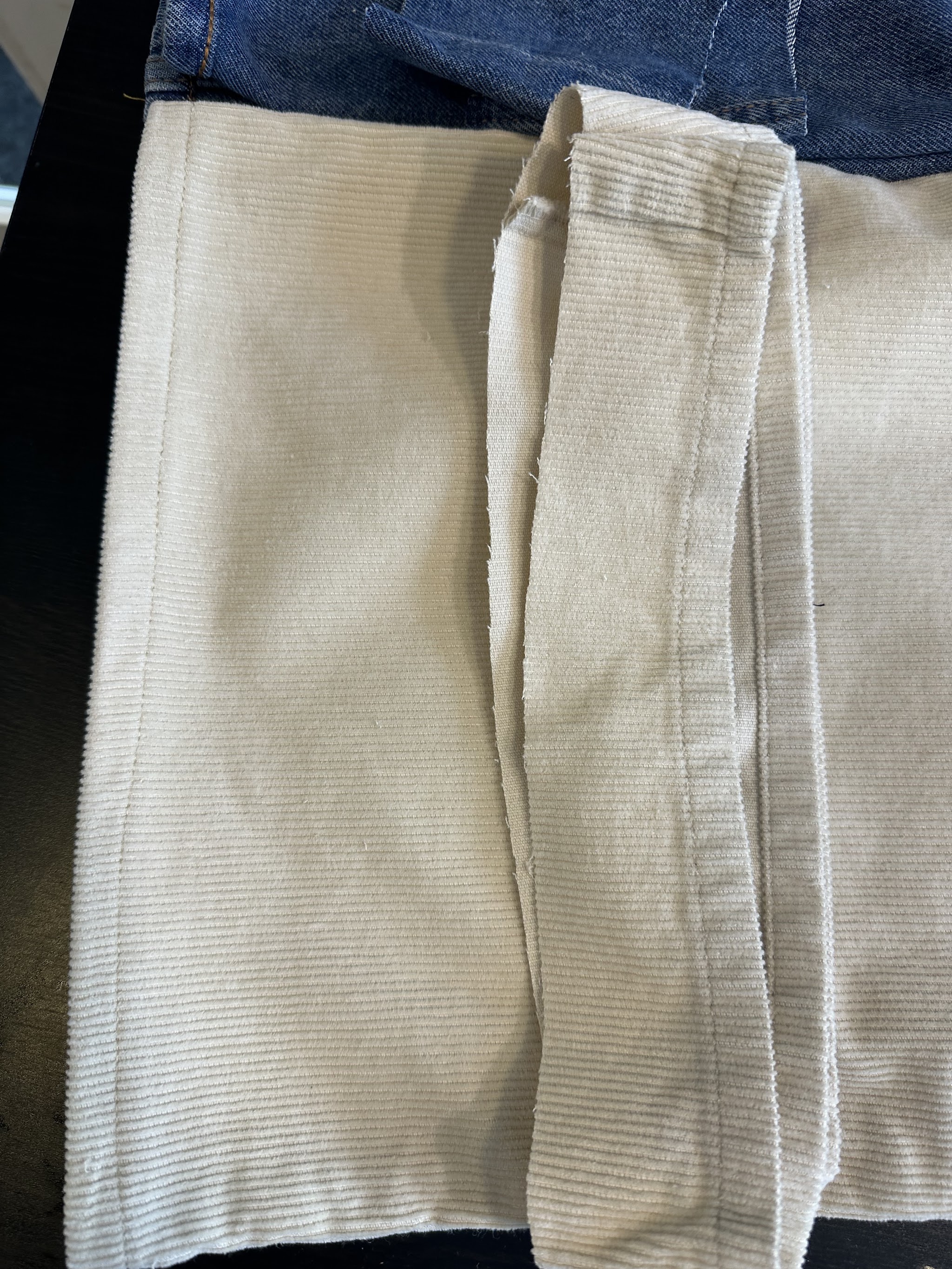 Cream fabric with a neatly sewn edge